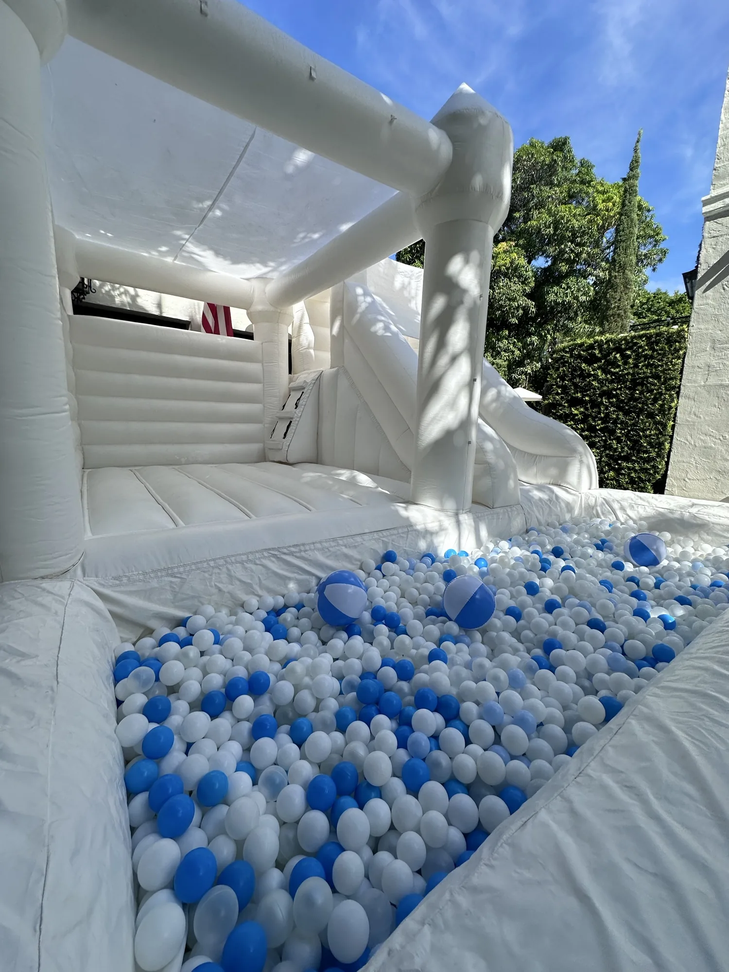 3-in-1 Empire Castle bounce house rental set up for a kids party in Miami, 16 × 16 ft white — 3 of 6