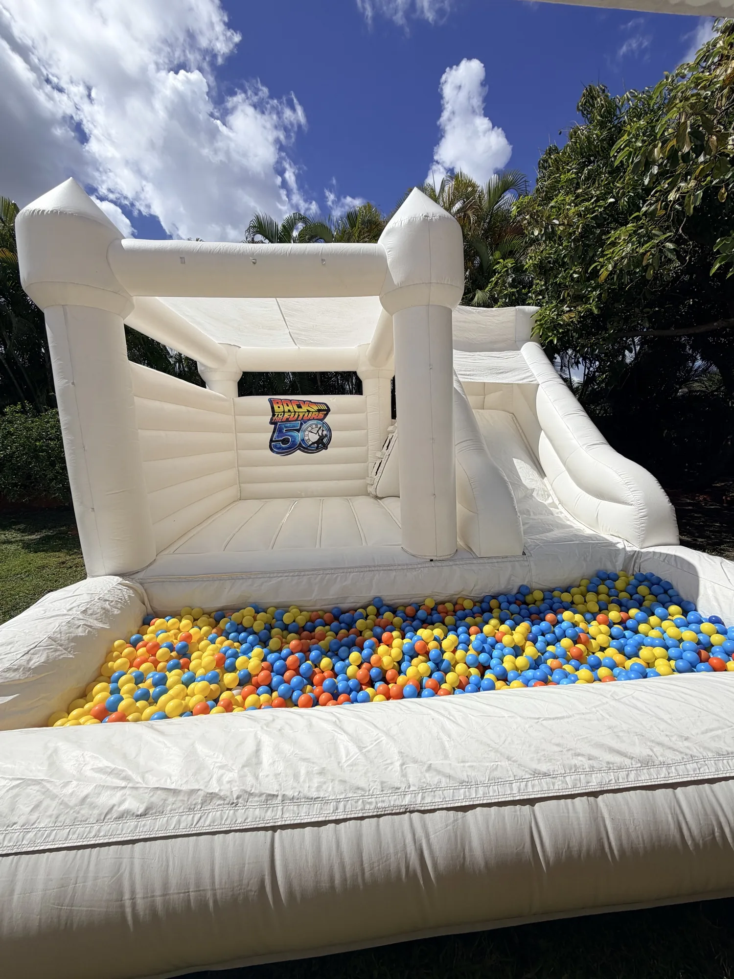 3-in-1 Empire Castle bounce house rental set up for a kids party in Miami, 16 × 16 ft white — 4 of 6