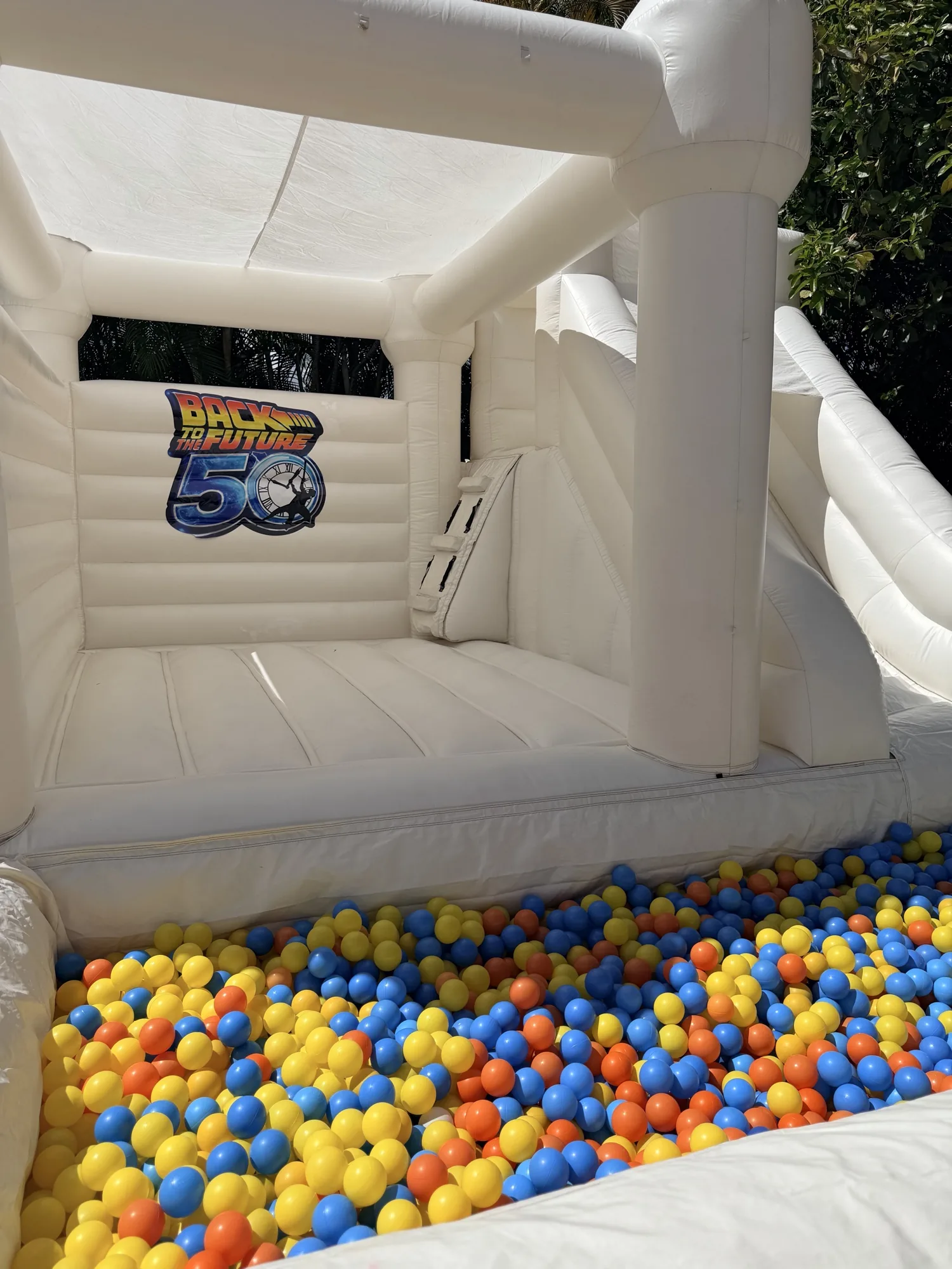 3-in-1 Empire Castle bounce house rental set up for a kids party in Miami, 16 × 16 ft white — 5 of 6